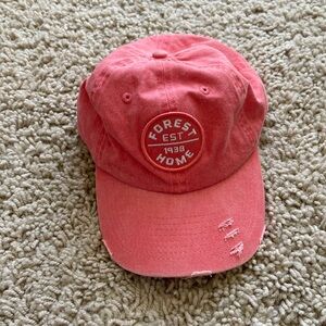 Forest Home peach color distressed camp hat. Adjustable strap. New never worn.
